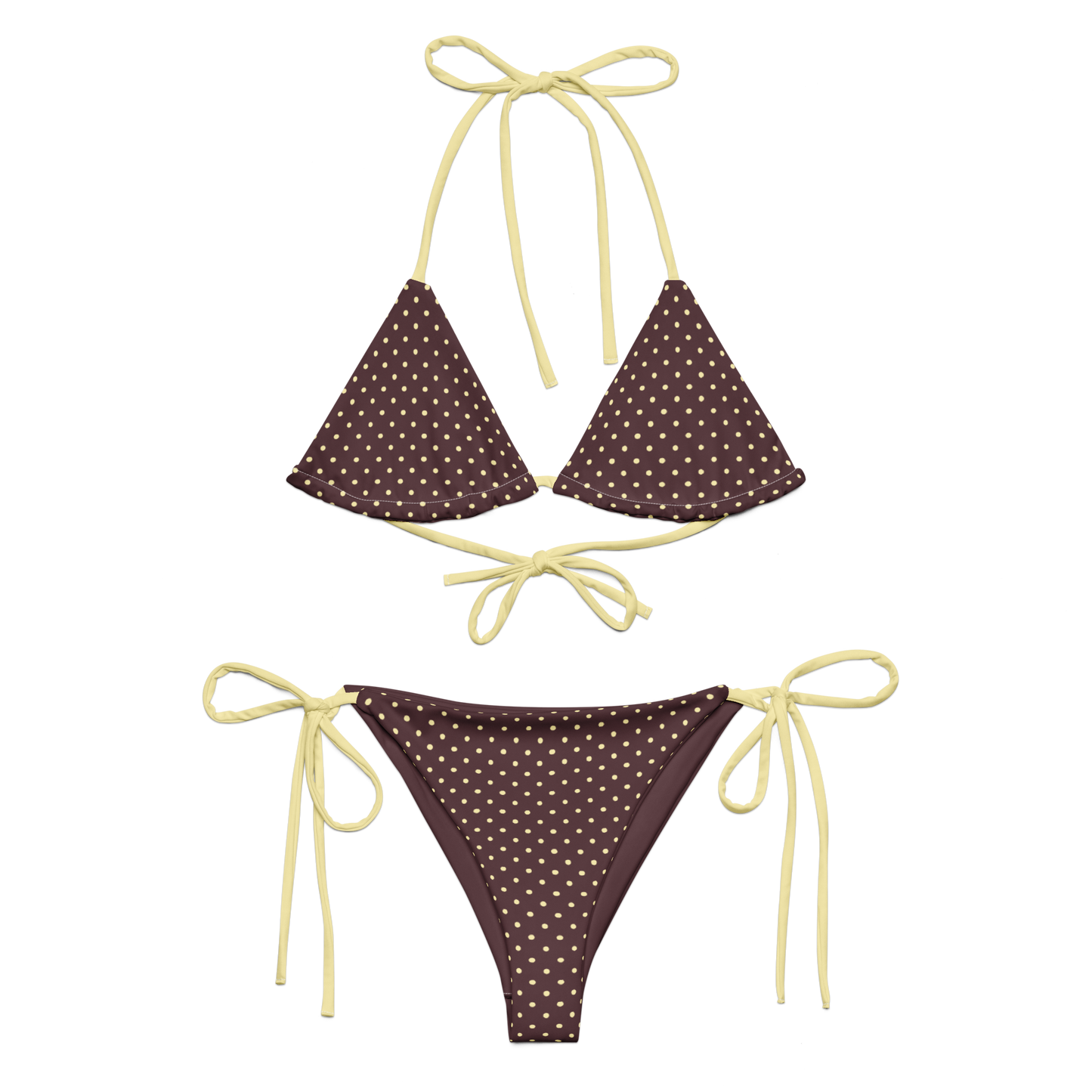 Brown bikini set with white polka dots and yellow strings on a white background