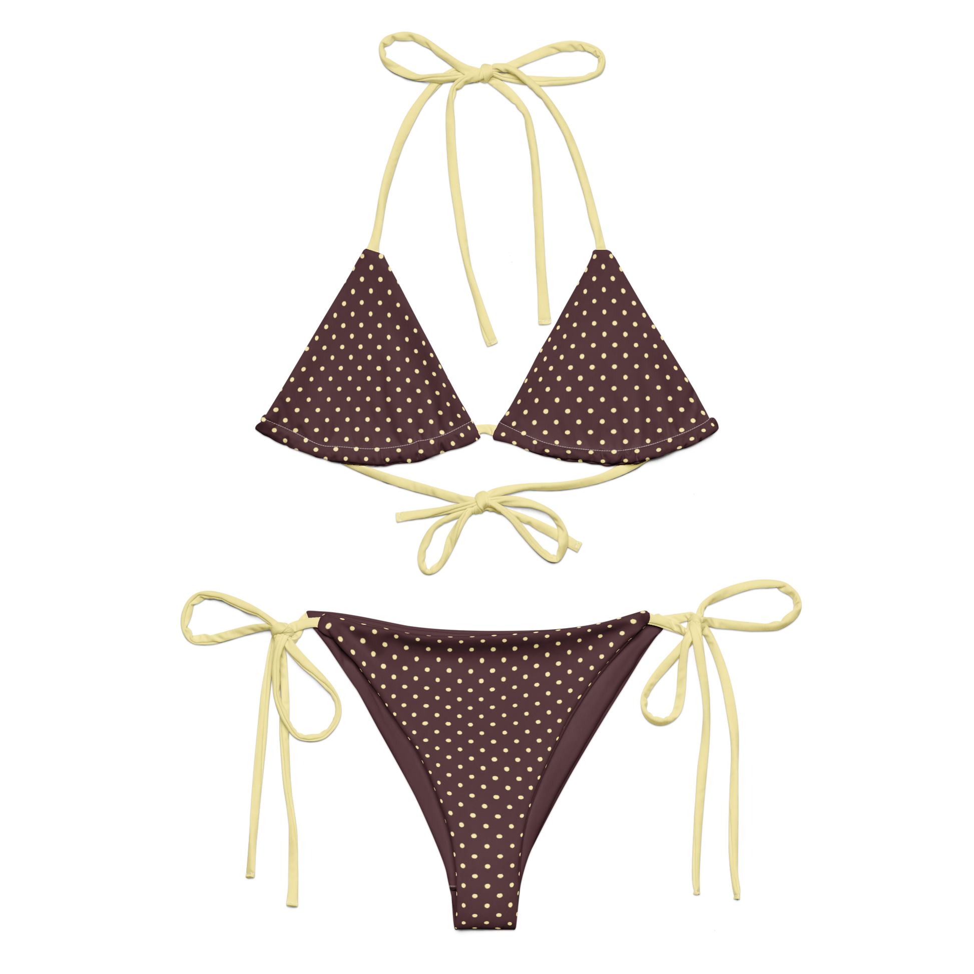 Brown bikini set with white polka dots and yellow strings on a white background
