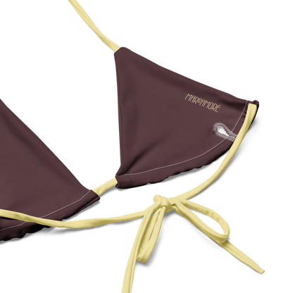 Brown bikini top lining with yellow straps on a white background