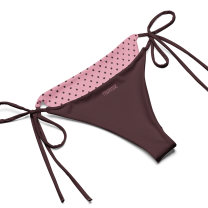 Pink bikini bottoms with brown lining and straps on a white background, product logo detail