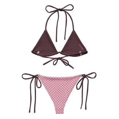 Two-piece bikini set with brown top and pink polka dot bottom on a white background