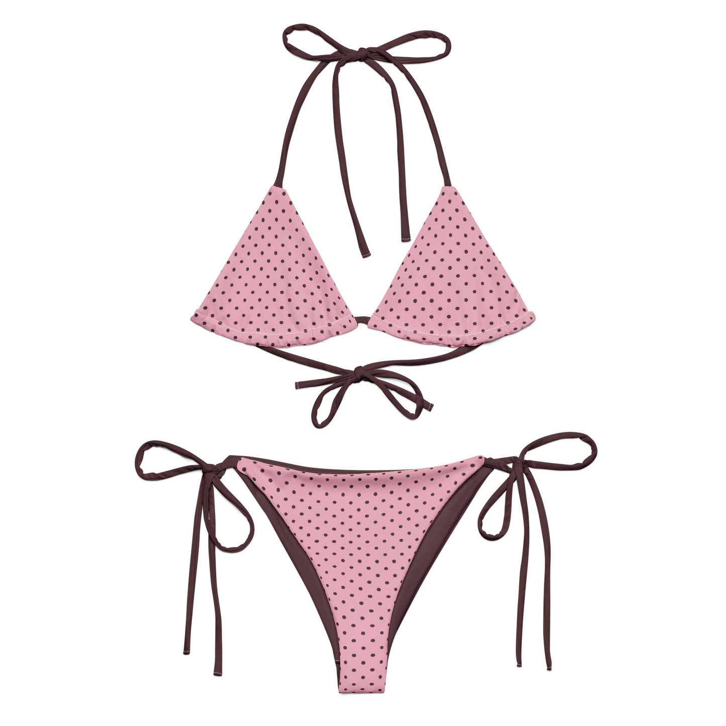 Pink polka dot bikini with brown straps on a white background
