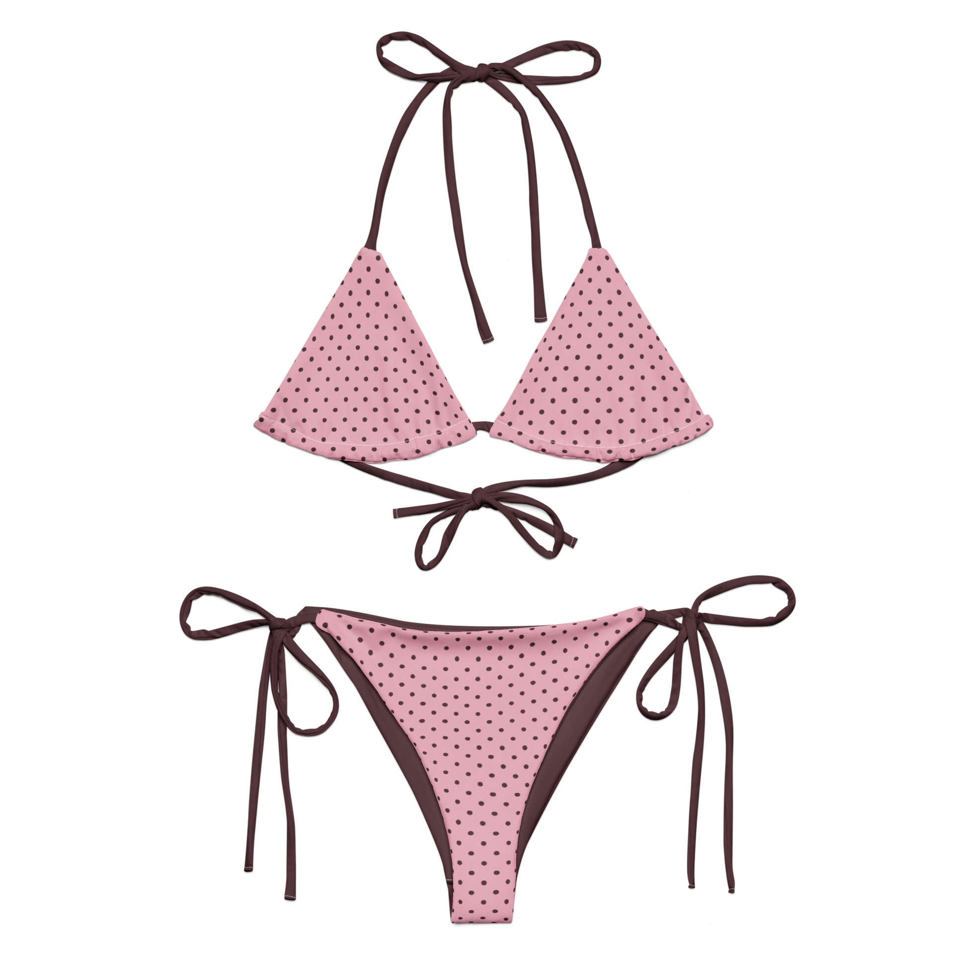 Pink polka dot bikini with brown straps on a white background