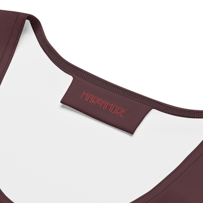Close-up of a brown crop top with 'MAReAMORE' branding on a white background